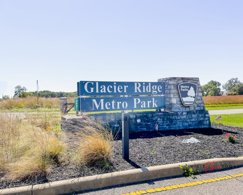 landscape photo of a green sign that reads glacier ridge metro park