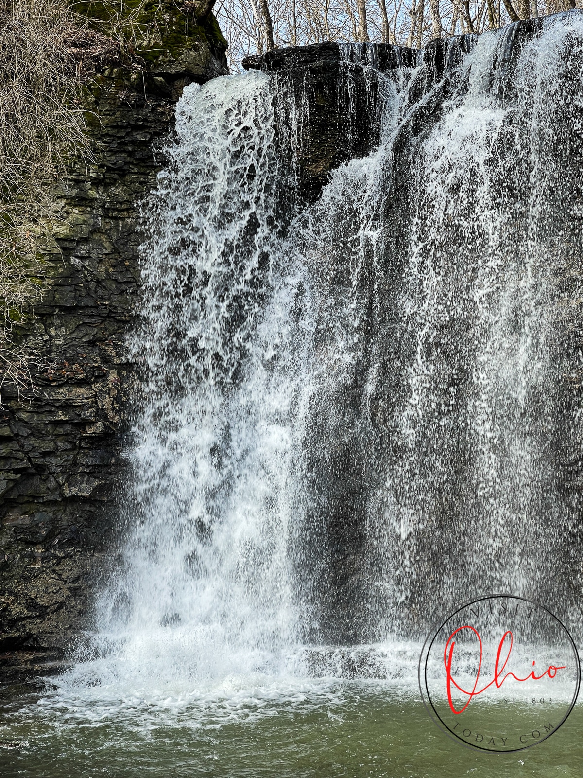 water falls down on a rock, a big waterfall