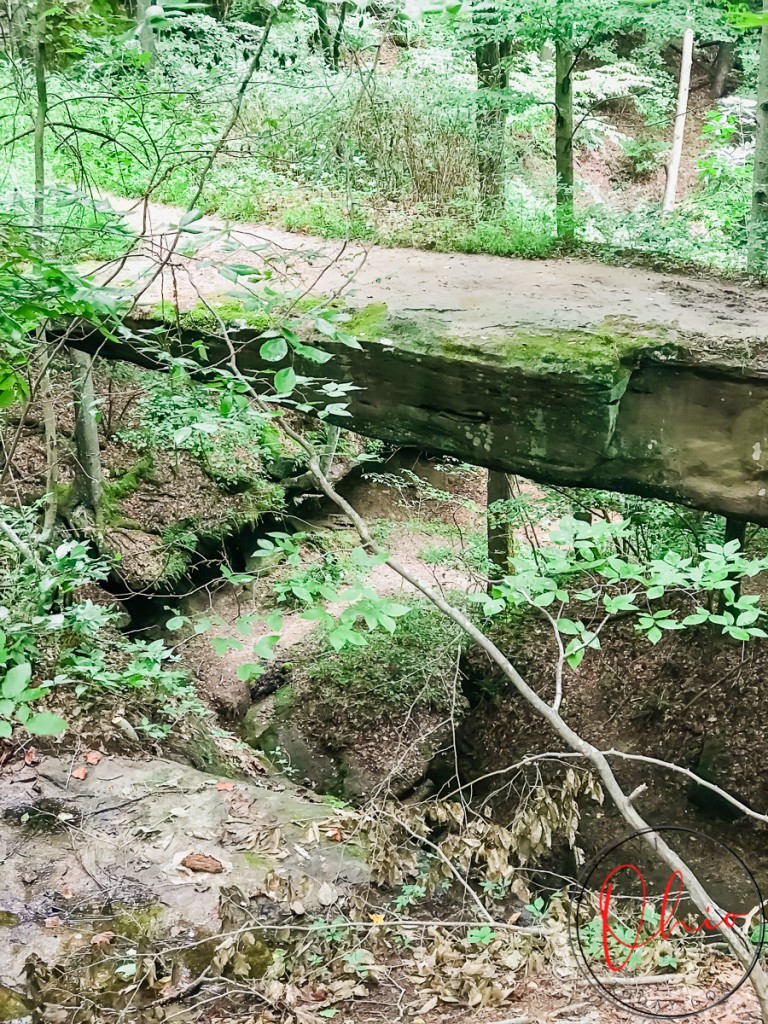 pictured is a natural bridge made from rock in hocking hills