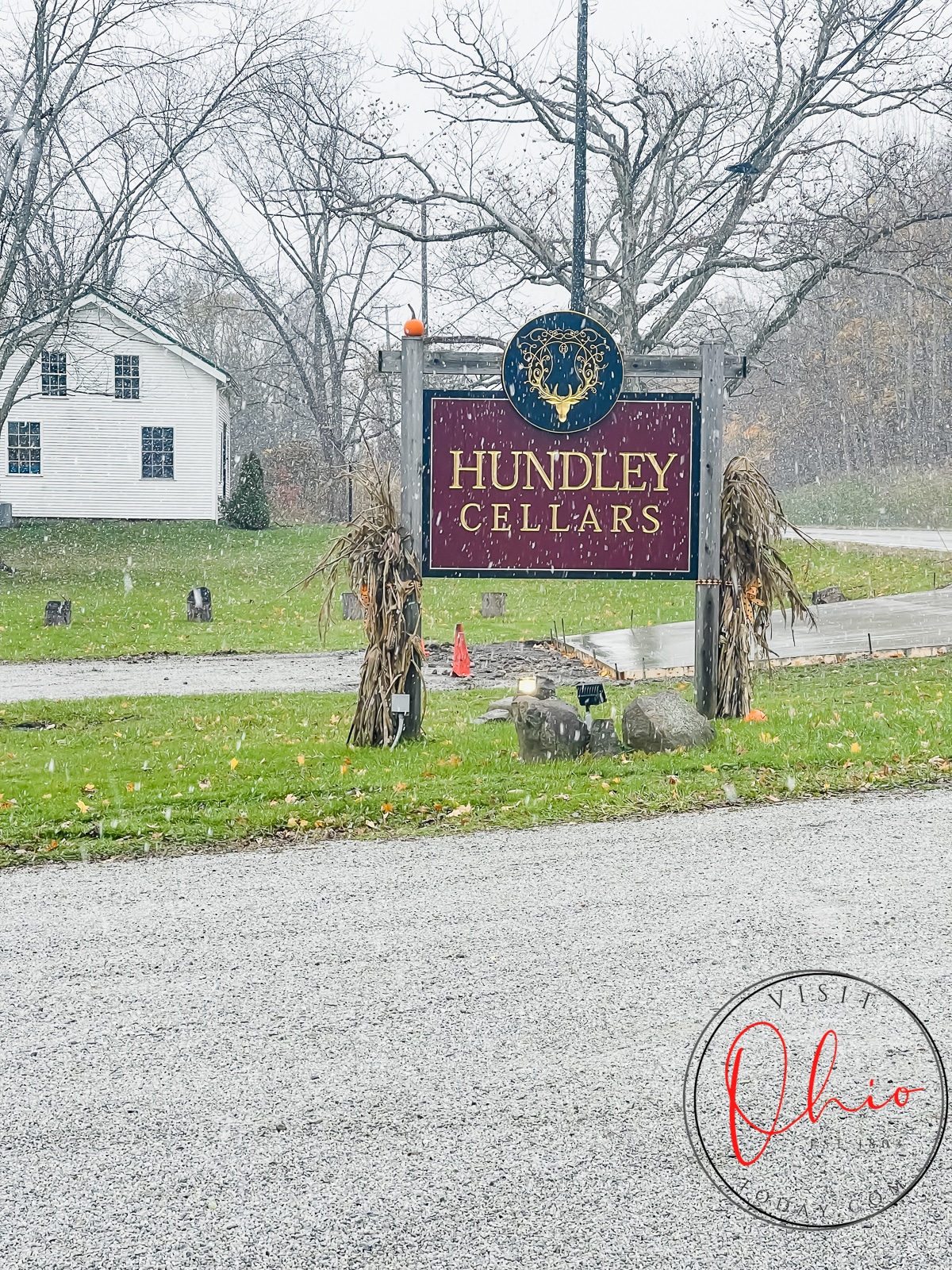 gravel driveway, white house in far background Maroon sign with name Hundley cellars written on it  Photo credit: Cindy Gordon of VisitOhioToday.com