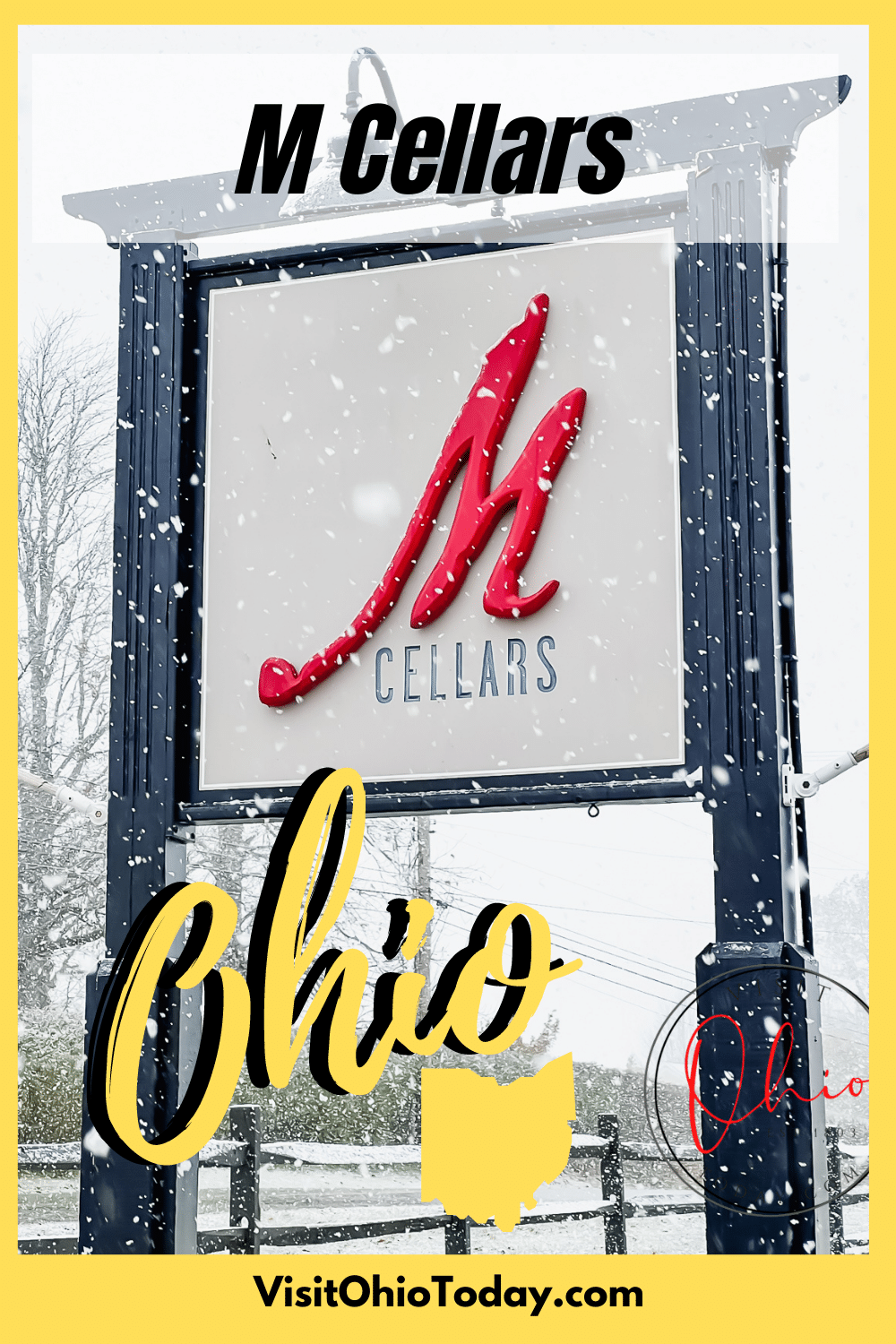 snowy weather and snow flakes on top of the M Cellars black, white and red sign