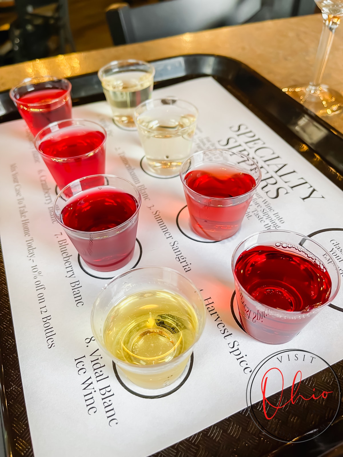 black plastic tray with white paper and tiny clear plastic cups filled with red and yellow liquid Photo credit: Cindy Gordon of VisitOhioToday.com