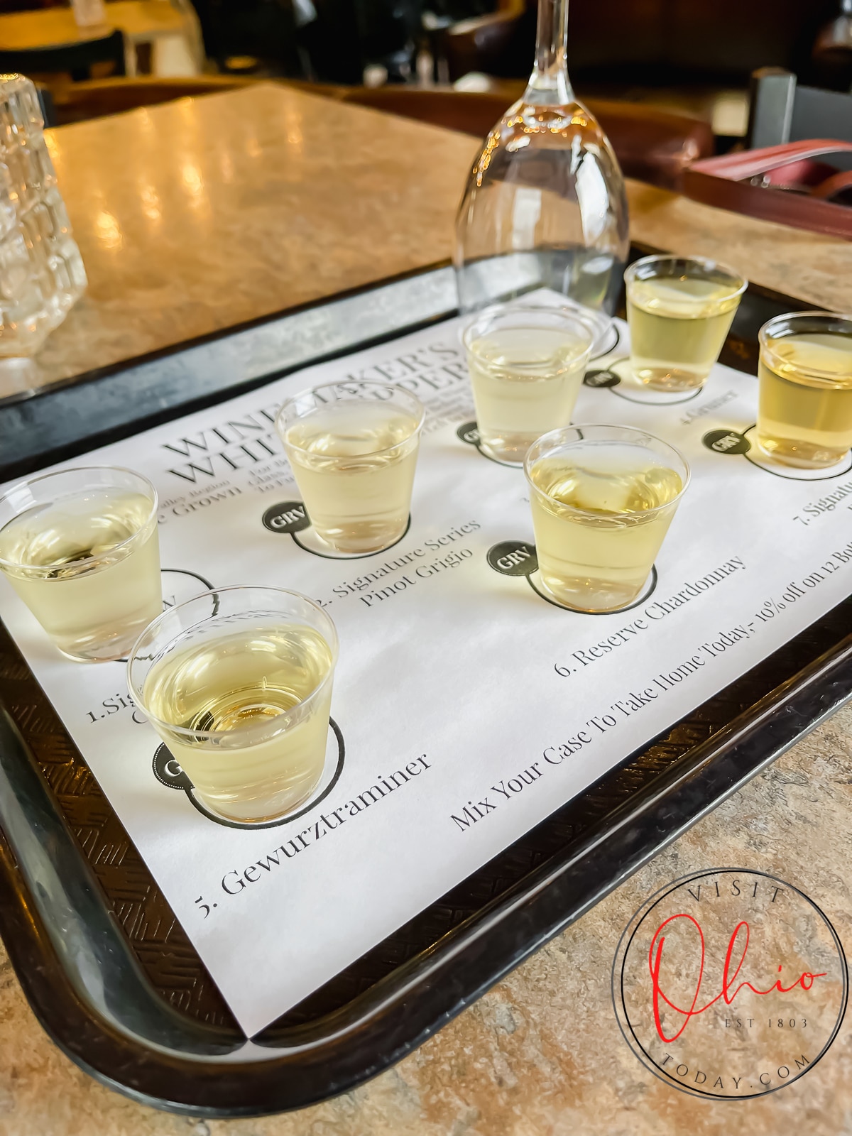 black plastic tray with clear mini glasses filled with yellow liquid Photo credit: Cindy Gordon of VisitOhioToday.com