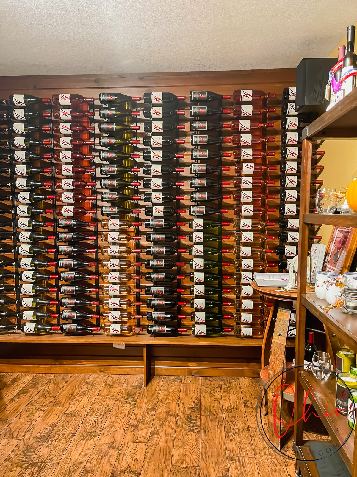 brown wooden shelf filled with wine bottles laying on their side Photo credit: Cindy Gordon of VisitOhioToday.com