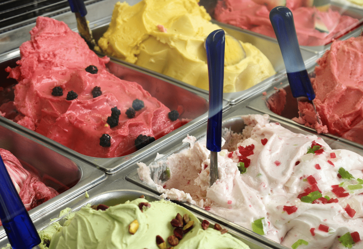 horizontal photo of a display of different flavors of ice cream