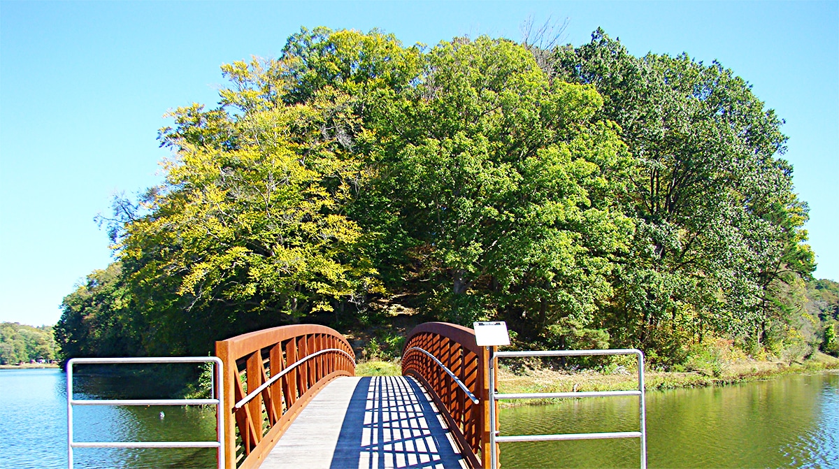 horizontal photo of a wooden bridge over Lake Alma at Lake Alma State Park