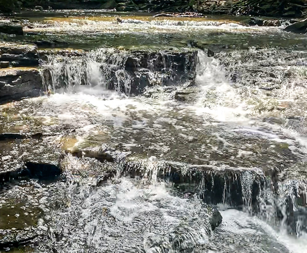horizontal photo of small waterfalls at Indian Run Falls. Photo credit: Cindy Gordon of VisitOhioToday.com