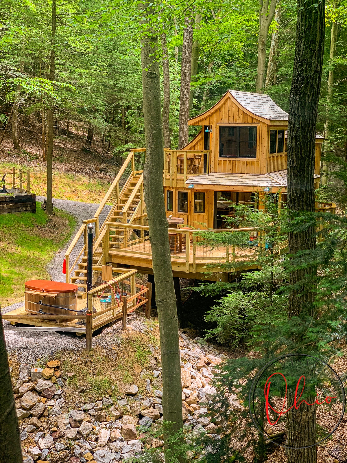 Wooden large treehouse among tall healthy trees with green leaves Photo credit: Cindy Gordon of VisitOhioToday.com