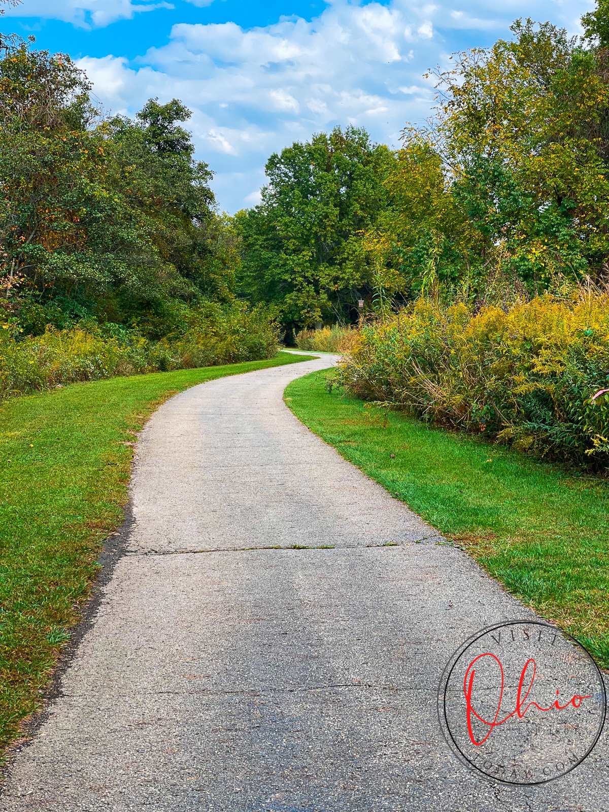 paved path with green grass and green trees to the sides. Photo credit: Cindy Gordon of VisitOhioToday.com