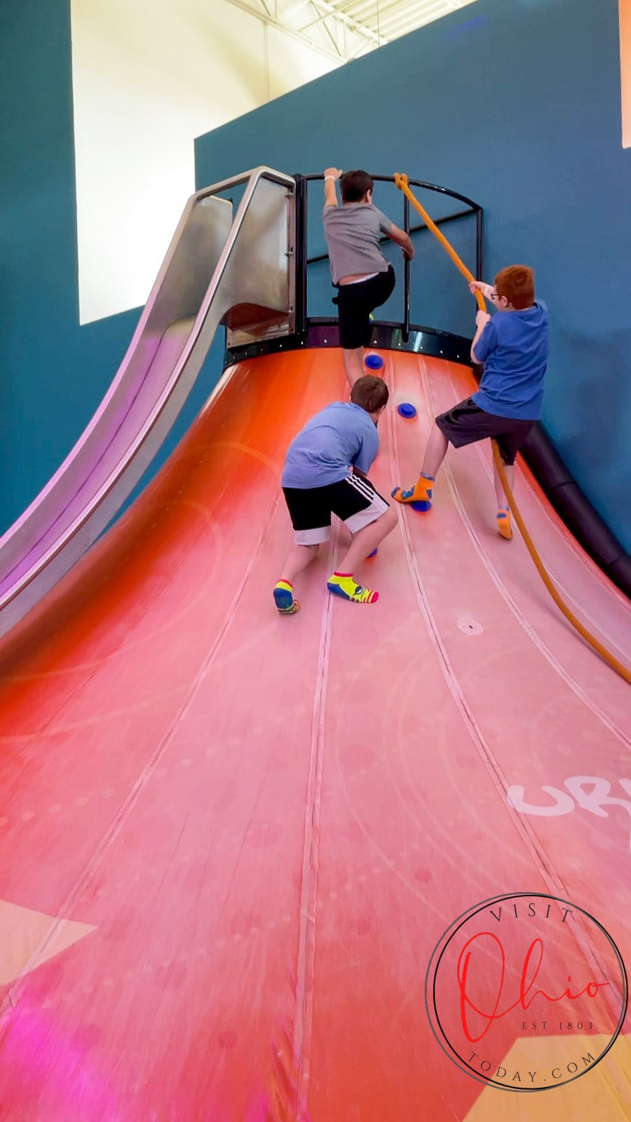 three kids climing a red volcano shaped slide Photo credit: Cindy Gordon of VisitOhioToday.com