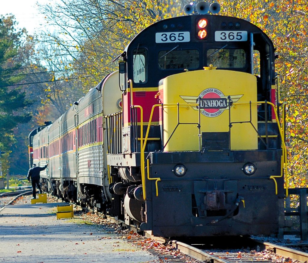 train rides in ohio yellow and black train on track