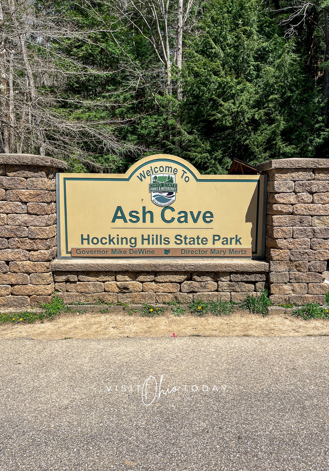 stone sign in woods that reads ash cave