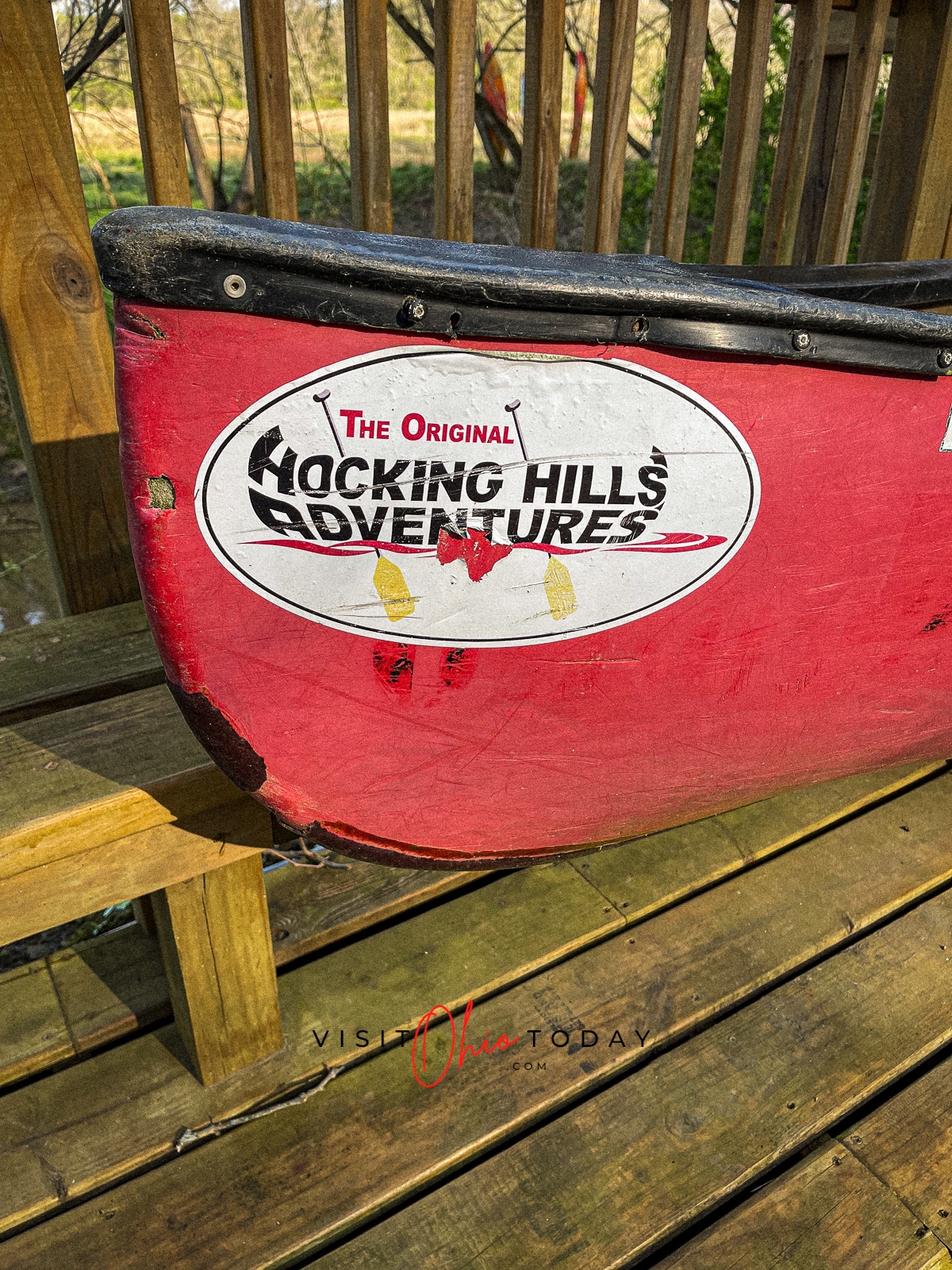 front of red canoe with hocking hills adventures sticker