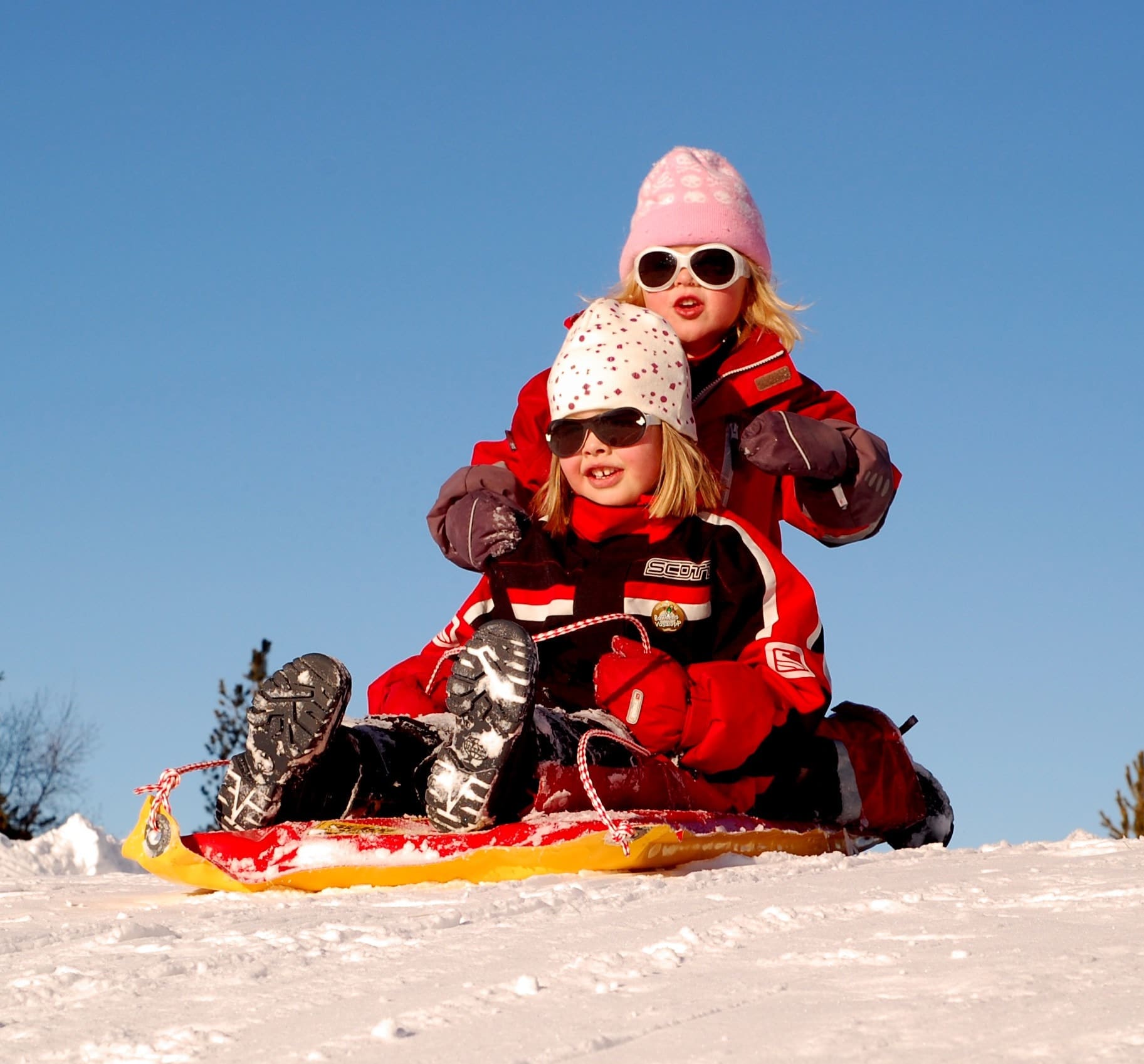 Two children on a sled (Ohio Sledding Hills)
