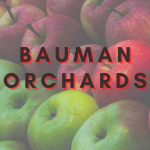 Close up photo of red and green apples. Text oberlay says Bauman Orchards