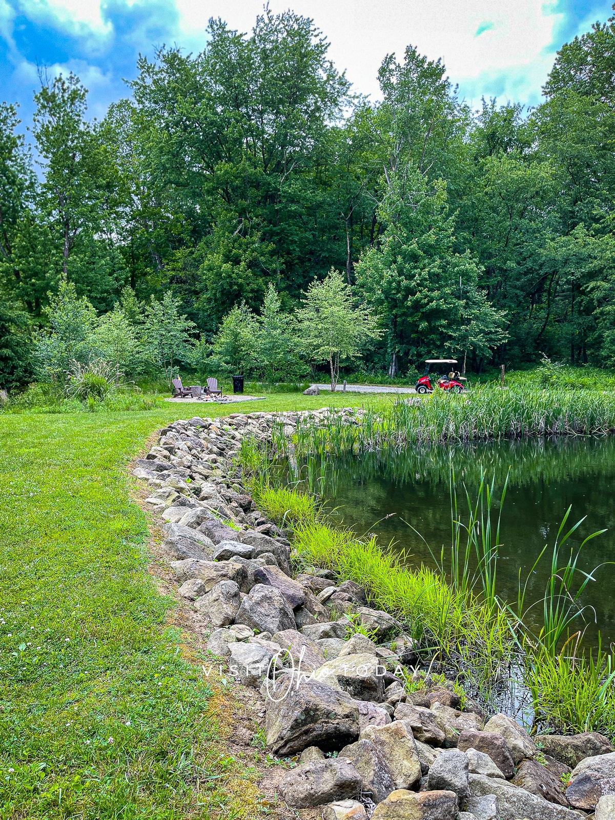 A stony path running alongside a lake
