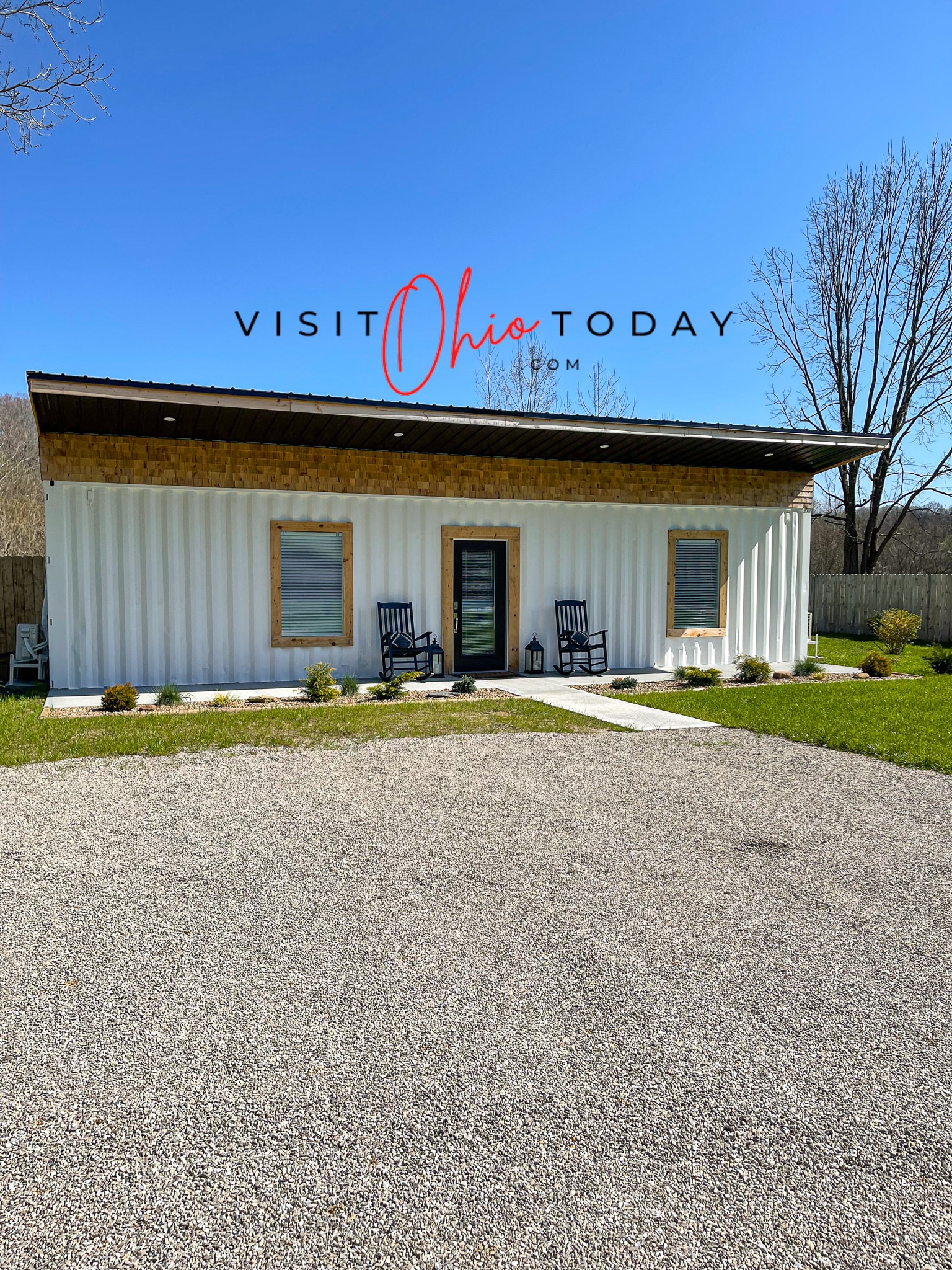 white container tiny house with gravel drive and blue sky above Photo credit: Cindy Gordon of VisitOhioToday.com