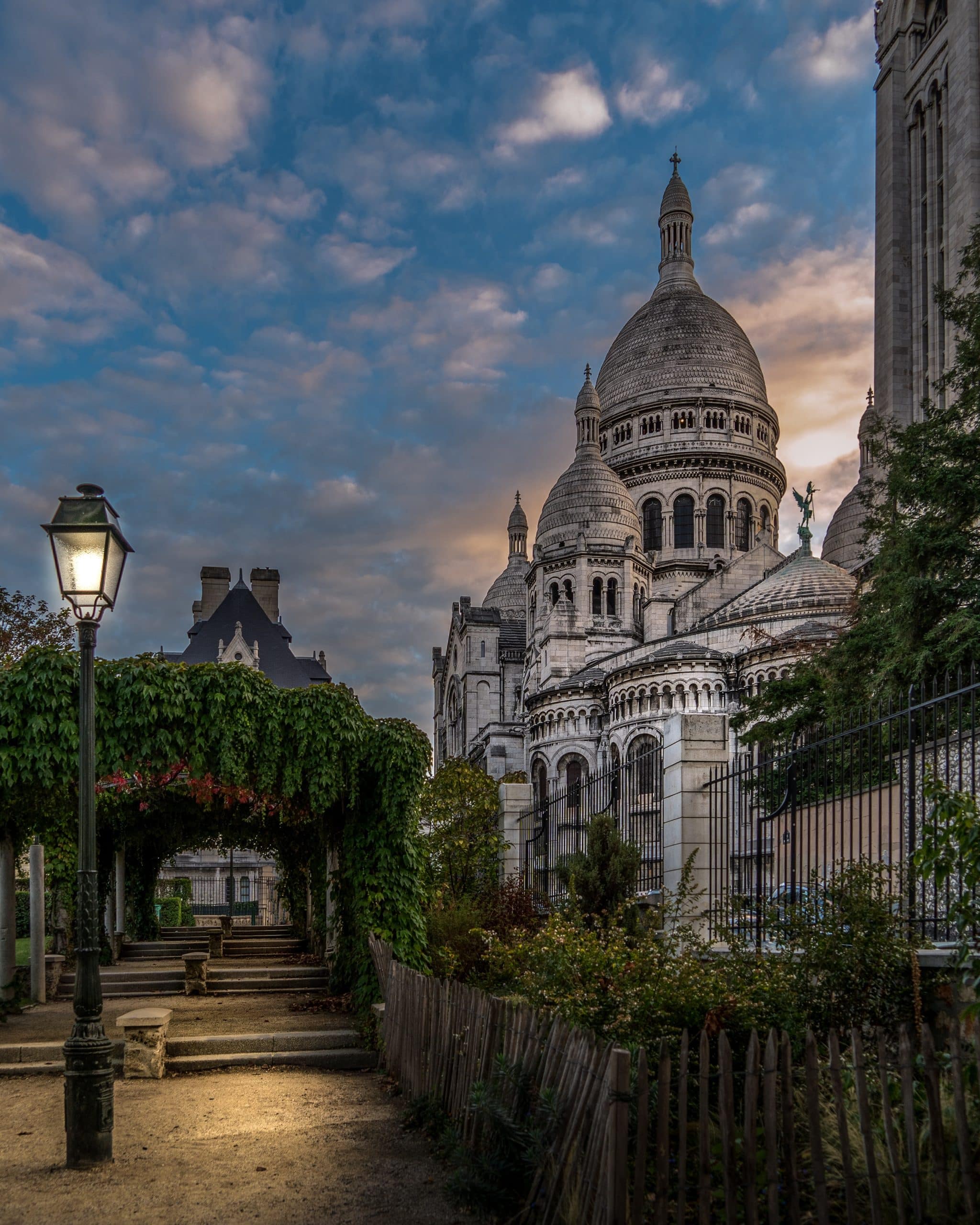 A night time image of a street with a basilica to the right