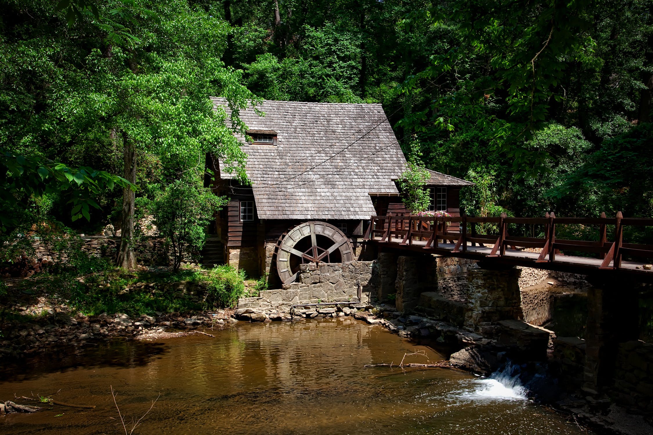 Photo of a mill by a river