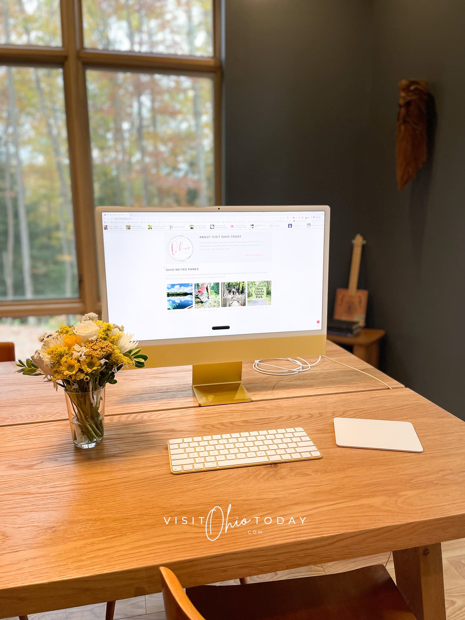 table with yellow computer on it and flowers in a vase Photo credit: Cindy Gordon of VisitOhioToday.com