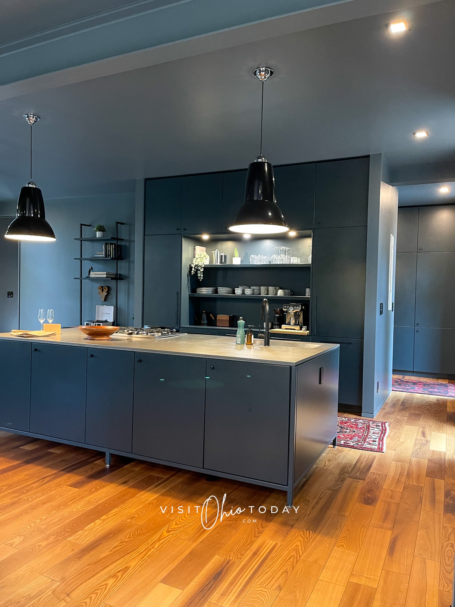 moody blue kitchen with blue cabinets and big blue counter top Photo credit: Cindy Gordon of VisitOhioToday.com