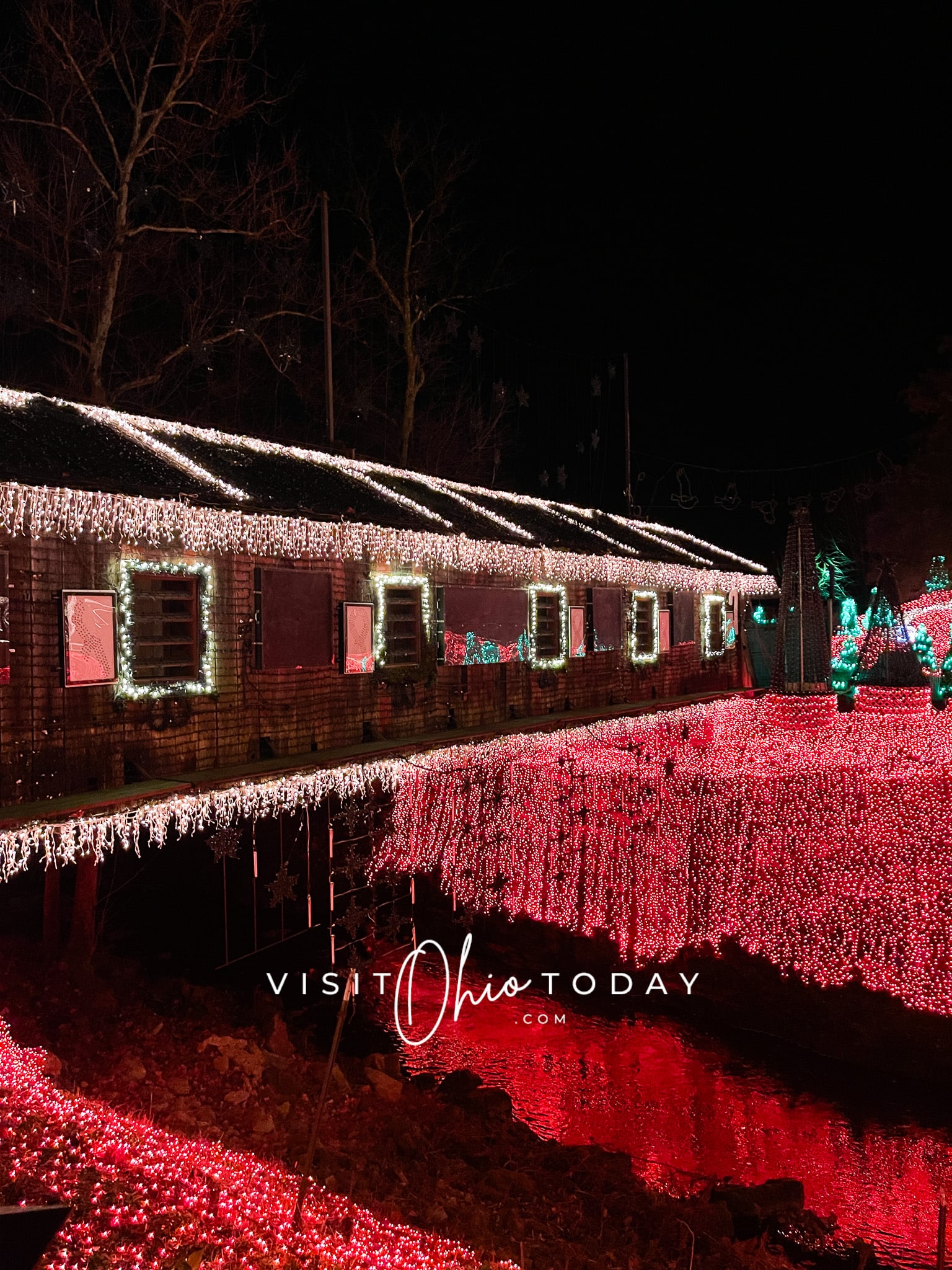 side of covered bridge at clifton mill christmas lights