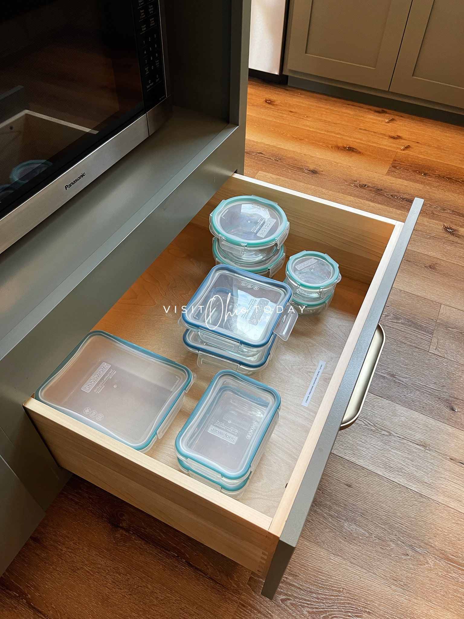 drawer pulled out with food storage containers inside