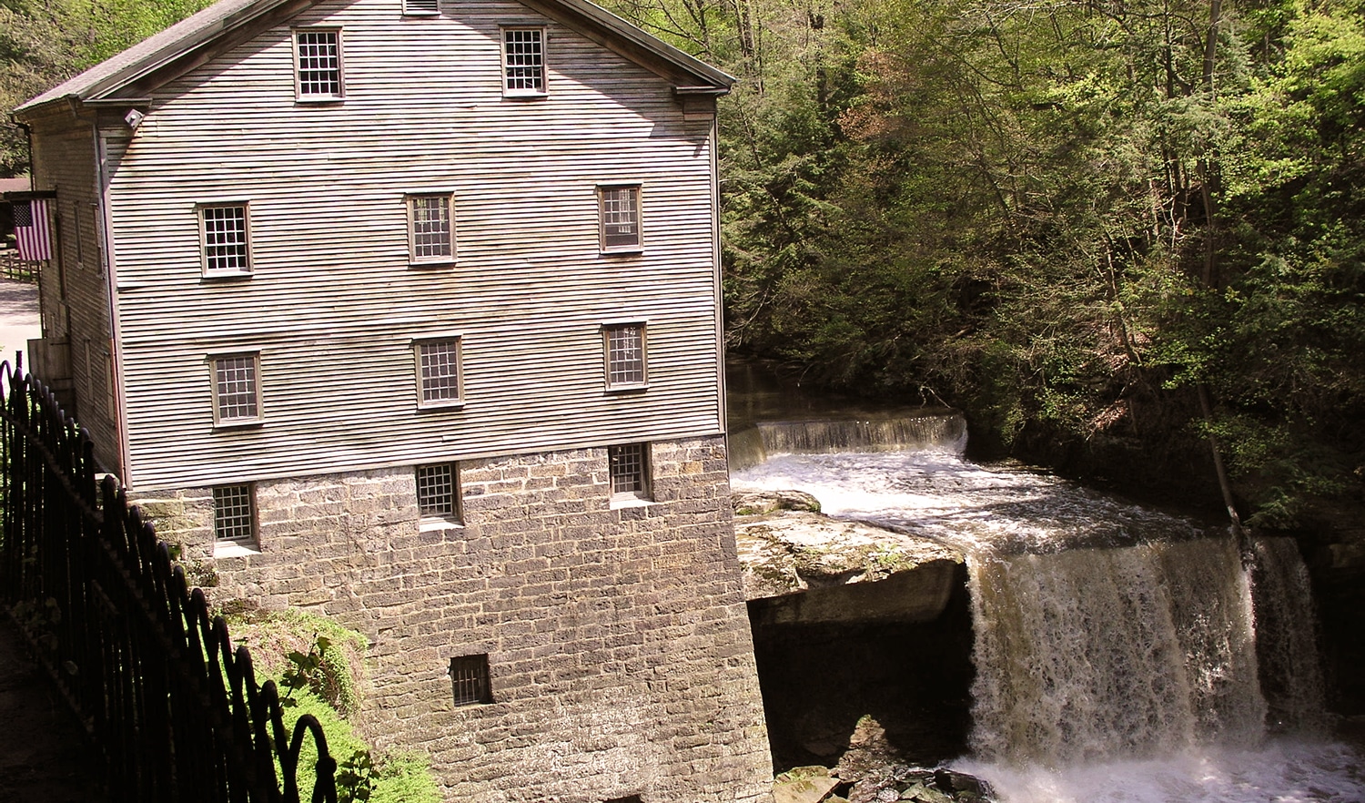 horizontal photo of Lanterman's Mill and the falls. Image via Wikimedia Commons - Public Domain