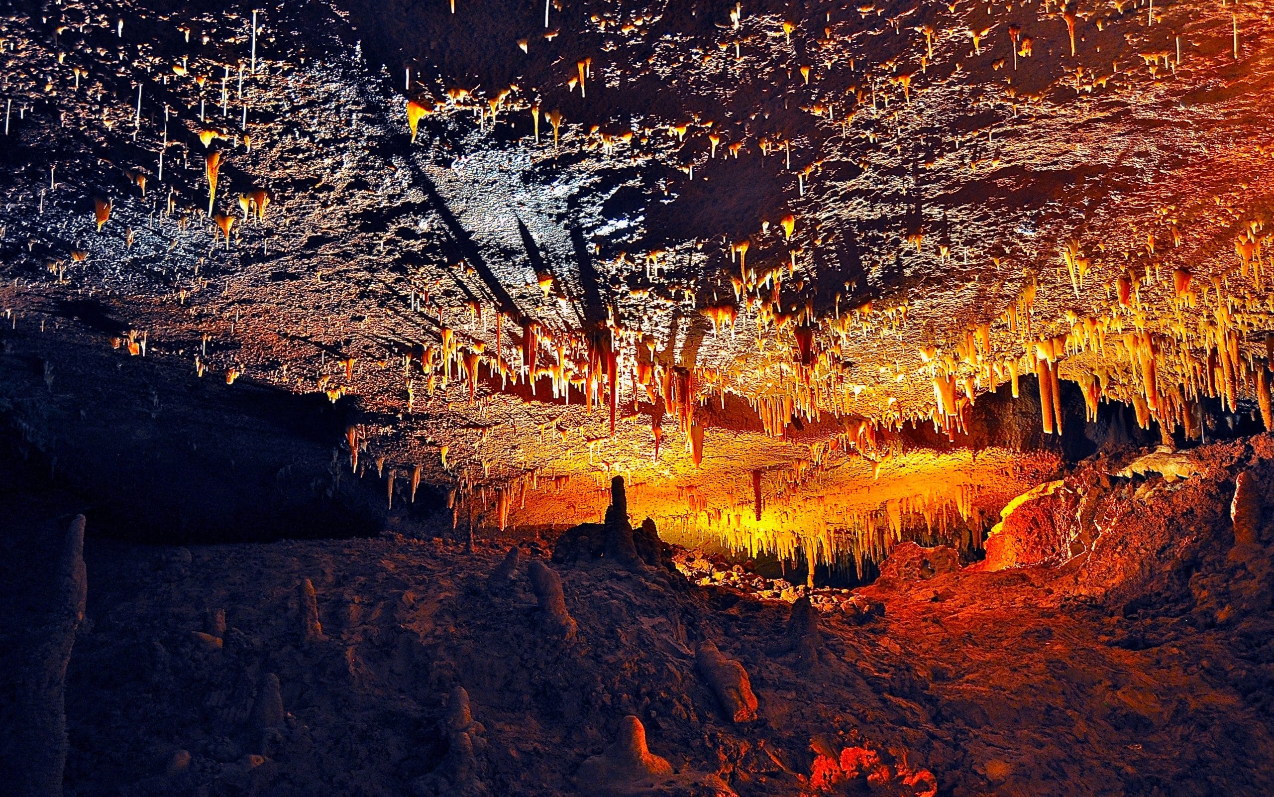 An image of stalagmite and stalactites inside a cave