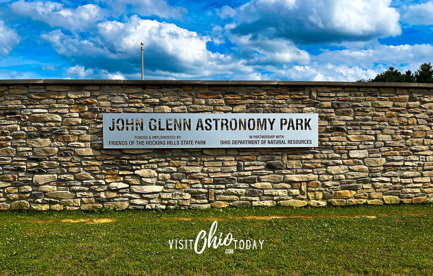 blue sky with white clouds, stone wall that says john glenn astronomy Photo credit: Cindy Gordon of VisitOhioToday.com
