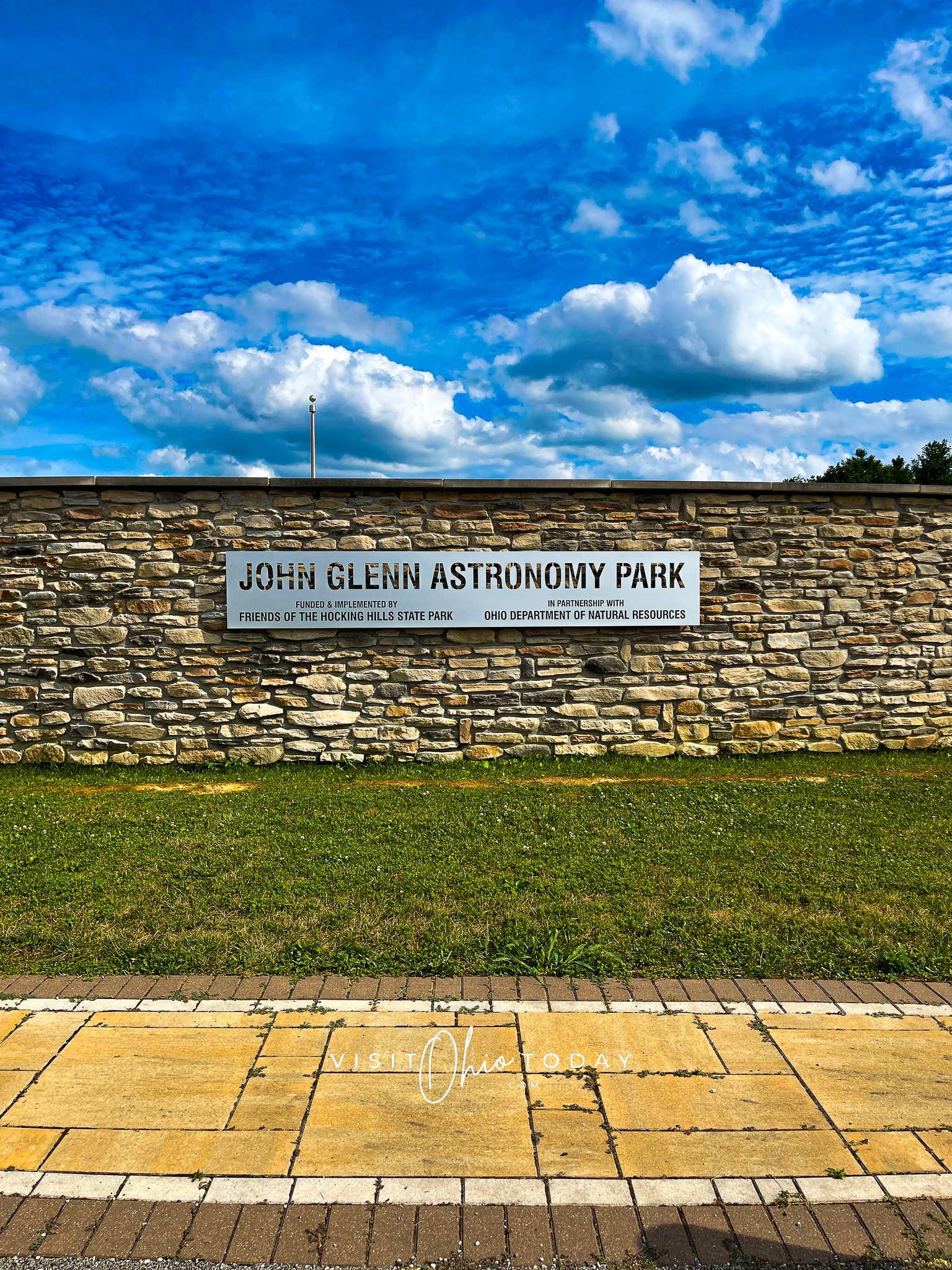 blue sky with white clouds, stone wall that says john glenn astronomy Photo credit: Cindy Gordon of VisitOhioToday.com