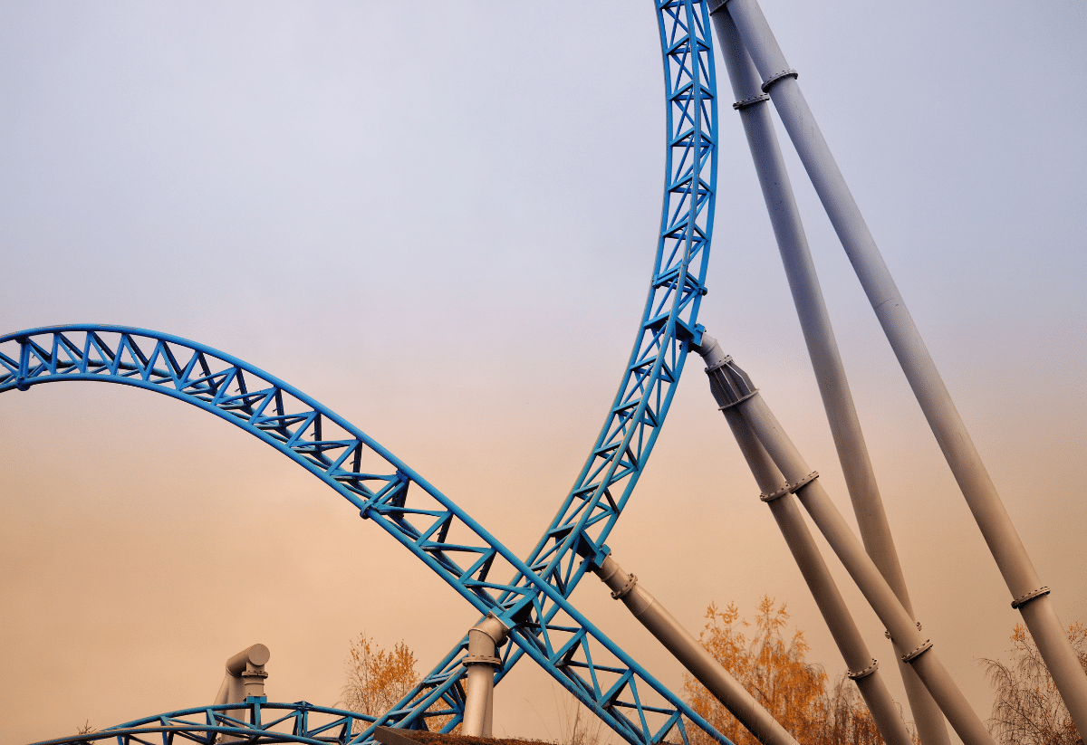 horizontal photo of part of a blue roller coaster