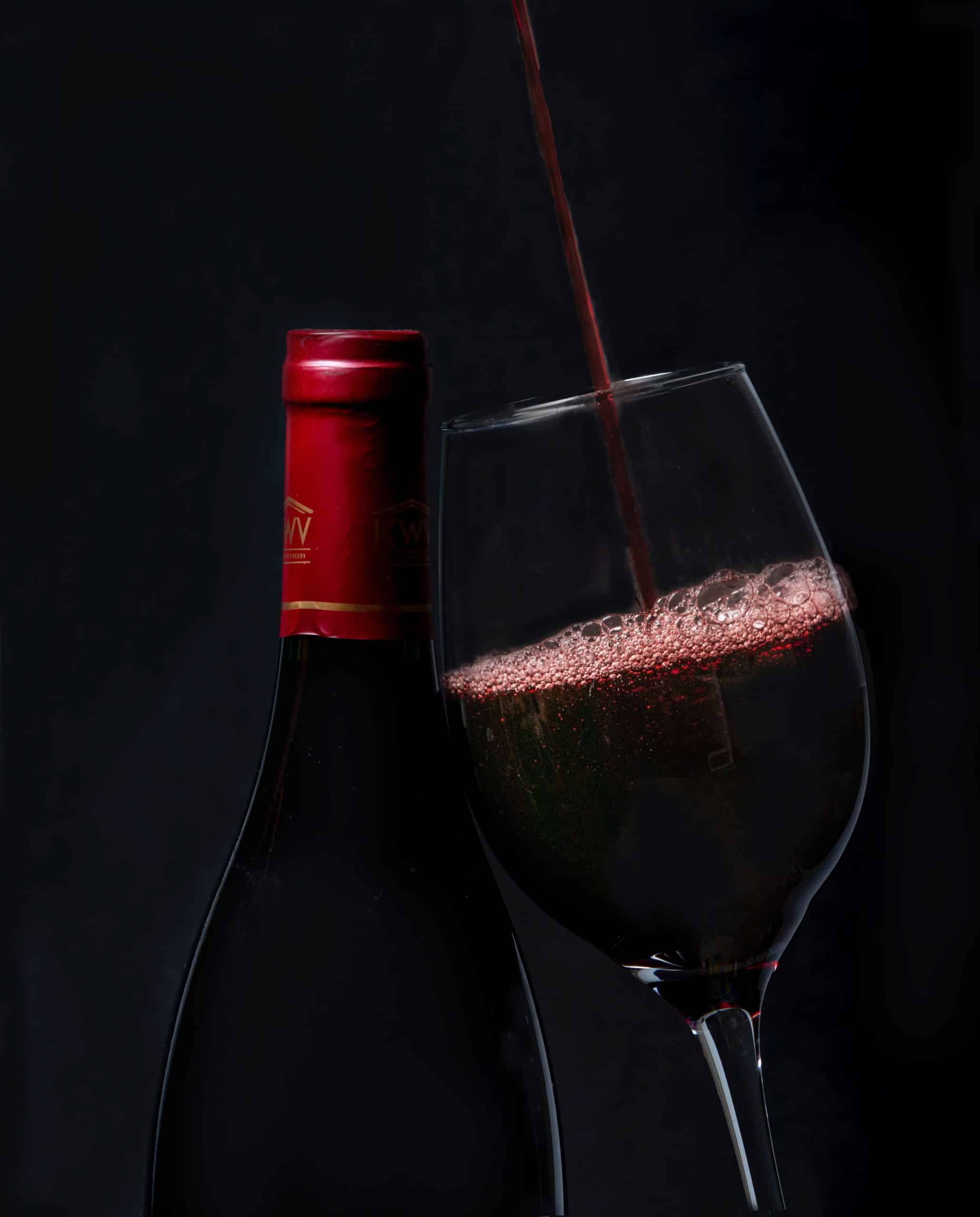 Red wine being poured into a glass