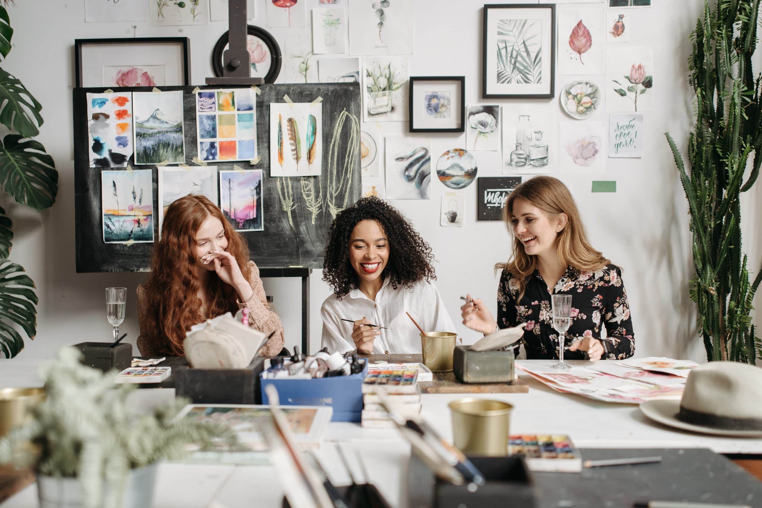 3 females painting and drinking wine