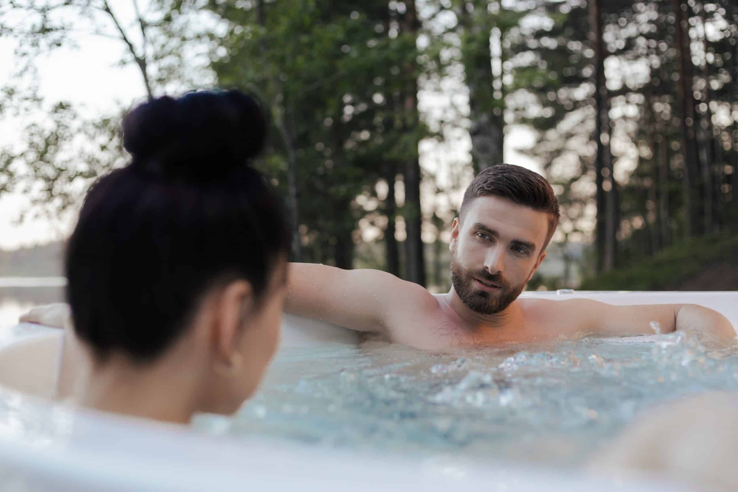 A couple sat in a hot tub