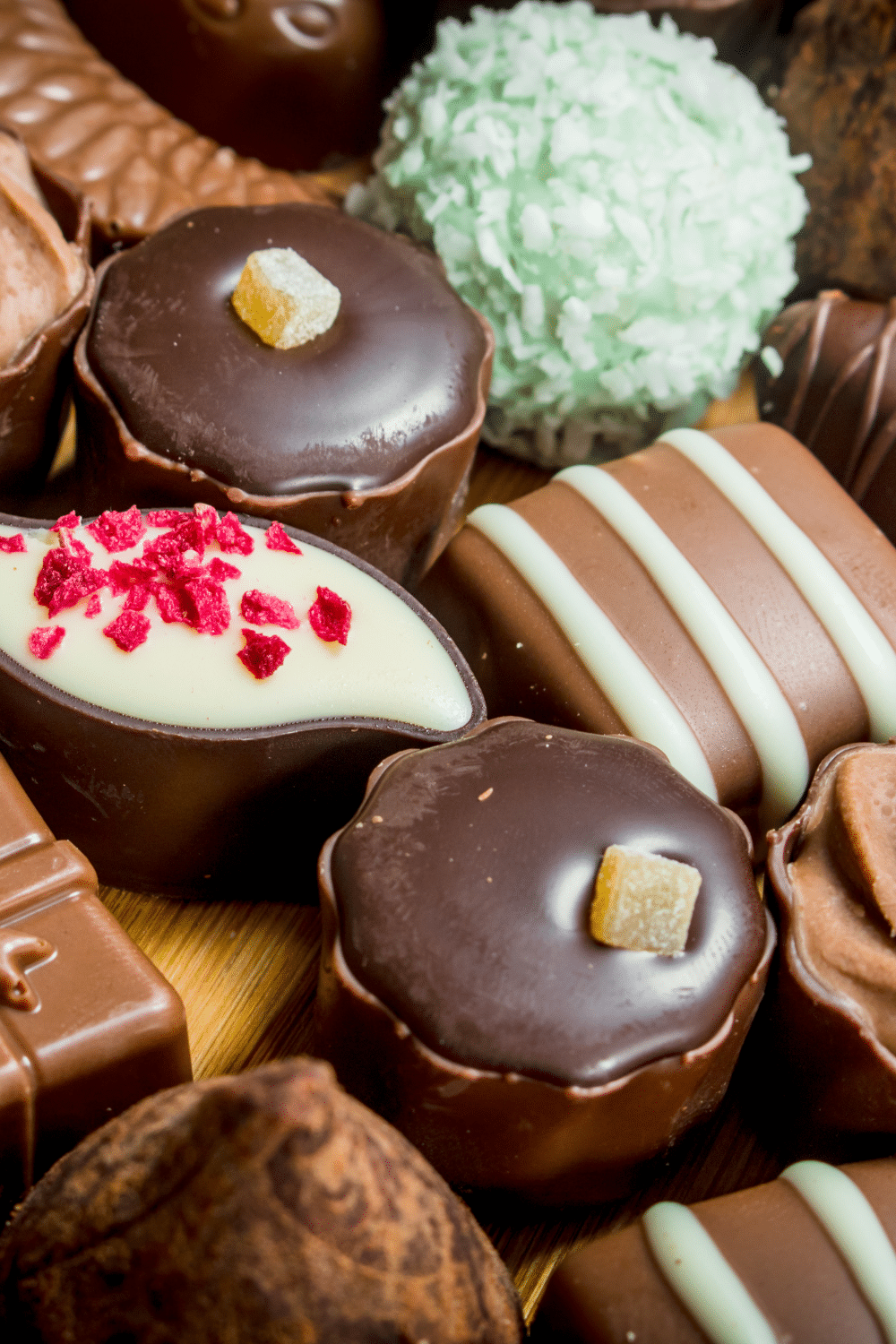 A selection of handmade chocolates of various colours and shapes