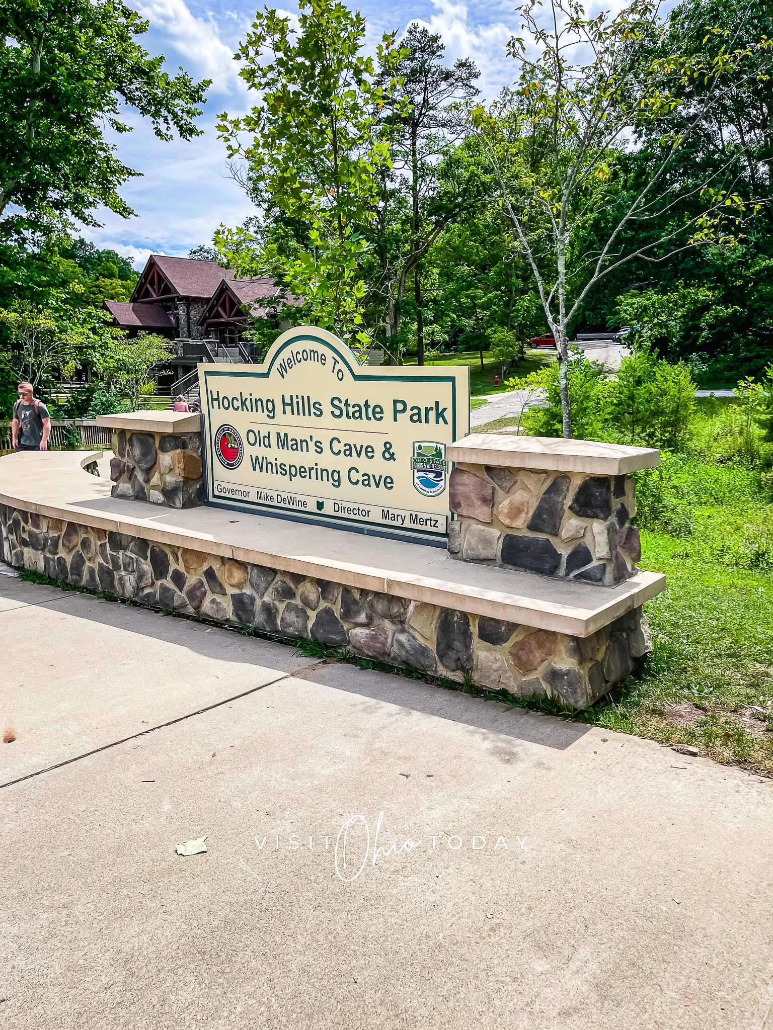 vertical photo of the entrance to Old Man’s Cave with the welcome center in the background. Photo credit: Cindy Gordon of VisitOhioToday.com