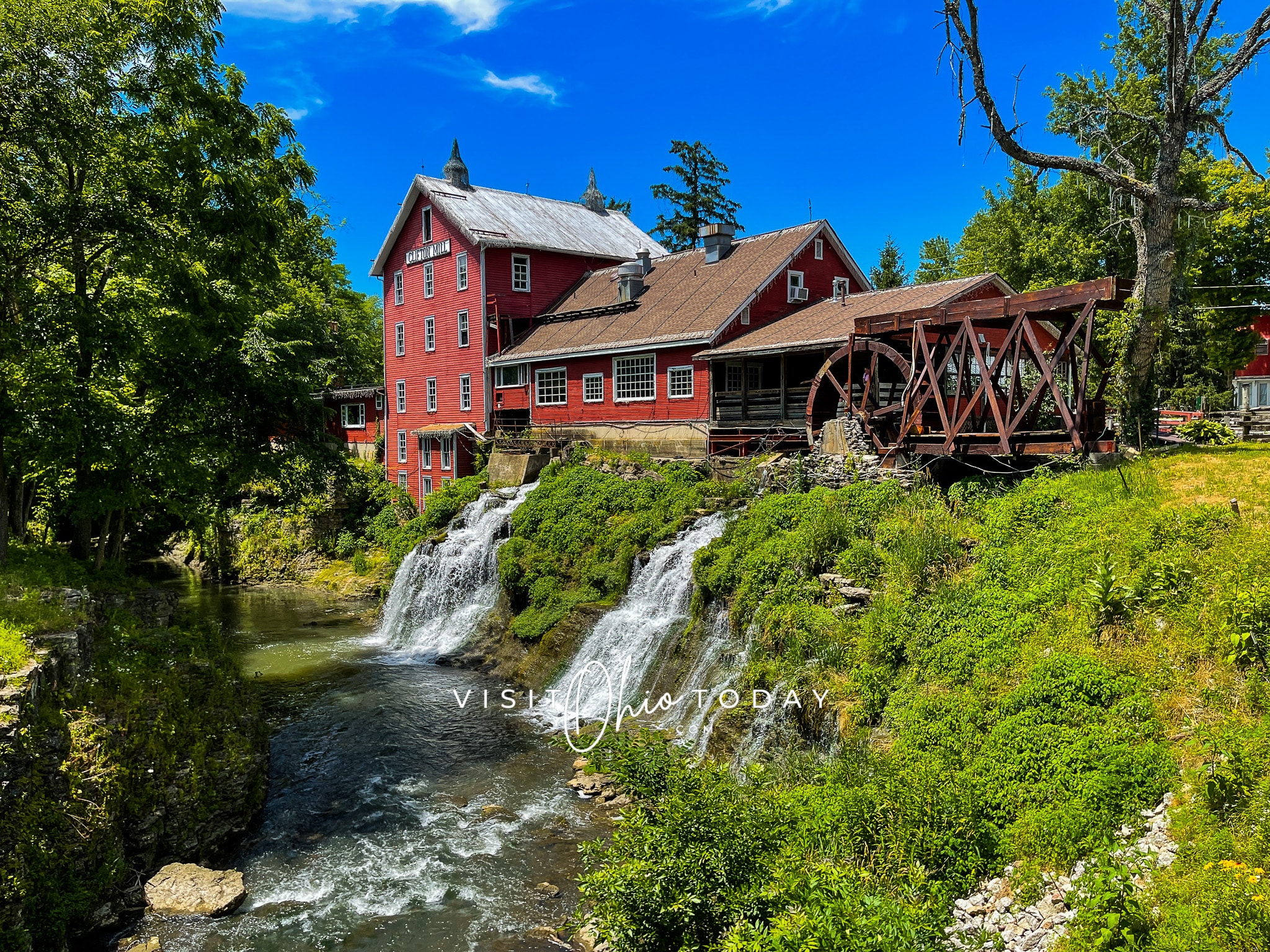 horizontal photo showing clifton mill with the double waterfall