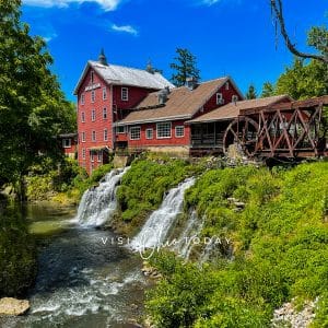 square photo of clifton mill, showing the double waterfall, the mill and the little miami river