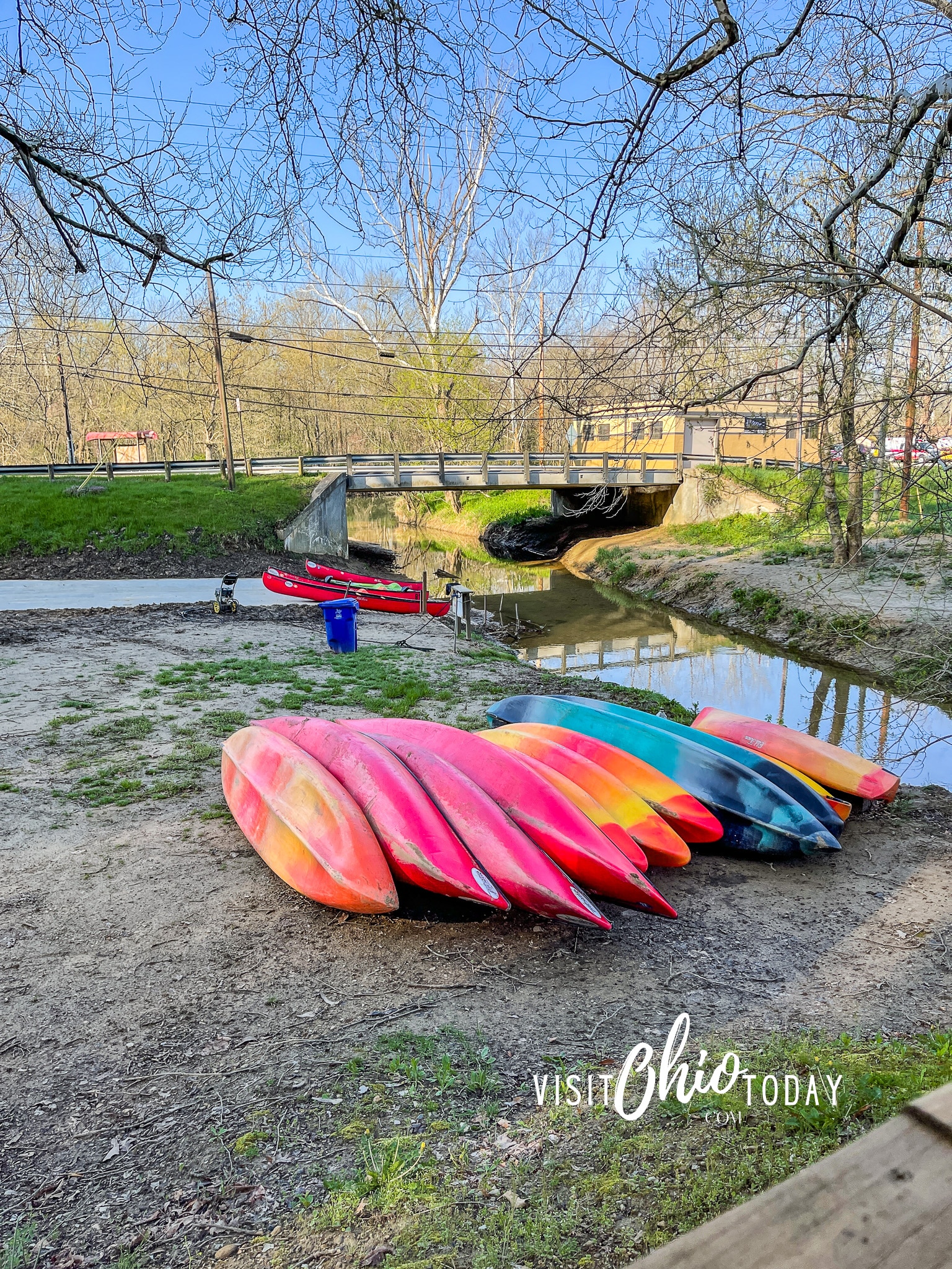 Photo of kayaks in hocking hills by a water source and a bridge Photo Credit: Cindy Gordon of VisitOhioToday.com