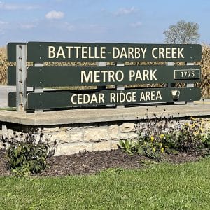 square photo of the entrance sign to battelle darby creek metro park - cedar ridge area
