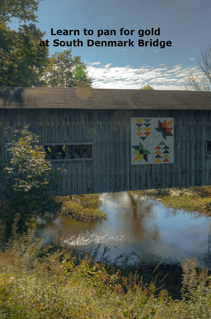 Vertical photo of a covered bridge in ashtabula county that takes part in the covered bridge festival