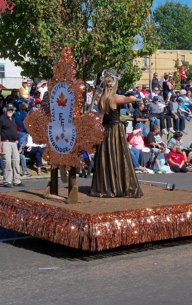 vertical photo showing a float with the 'queen' of the festival of leaves in ohio (fall festivals in ohio)