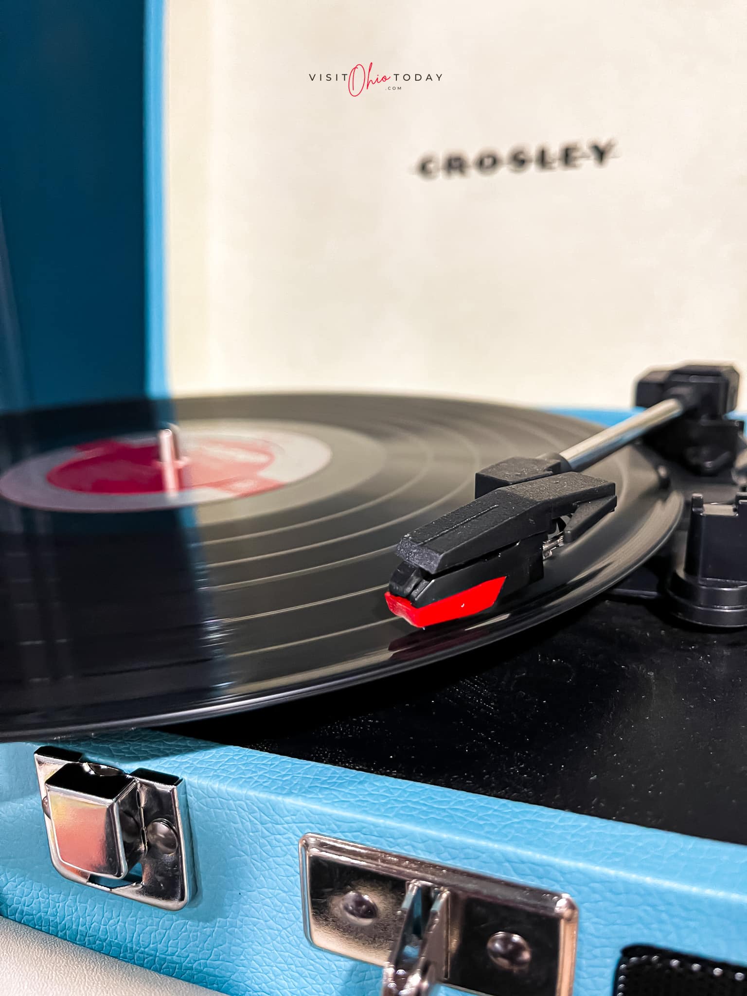 blue record player with black record on it