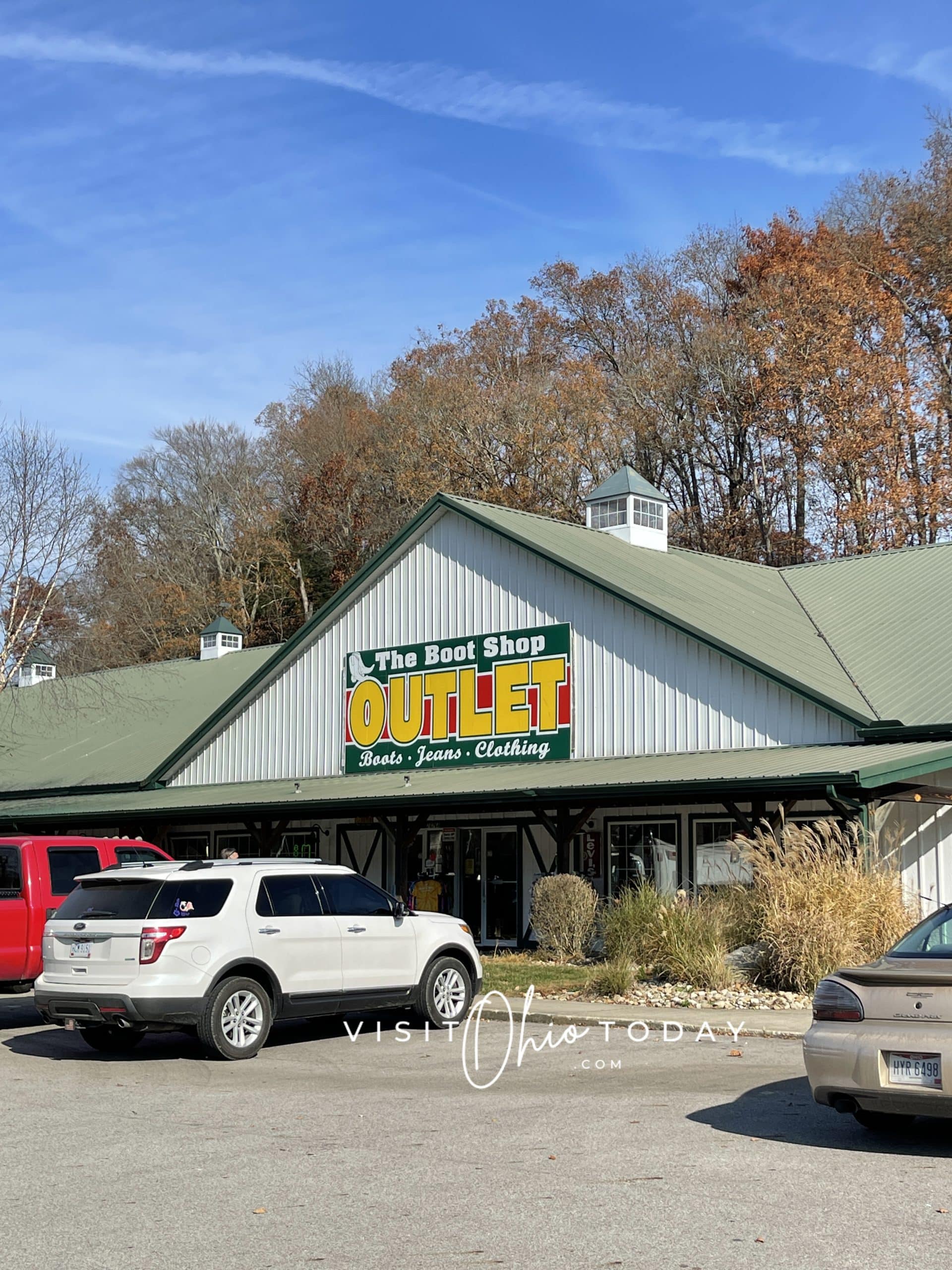 vertical photo of the front of the boot shop - outlet with cars in front and trees in the background Photo credit: Cindy Gordon of VisitOhioToday.com