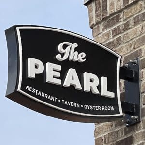 square photo showing the name hoarding outside the pearl dublin. It reads: The Pearl restaurant, tavern, oyster room