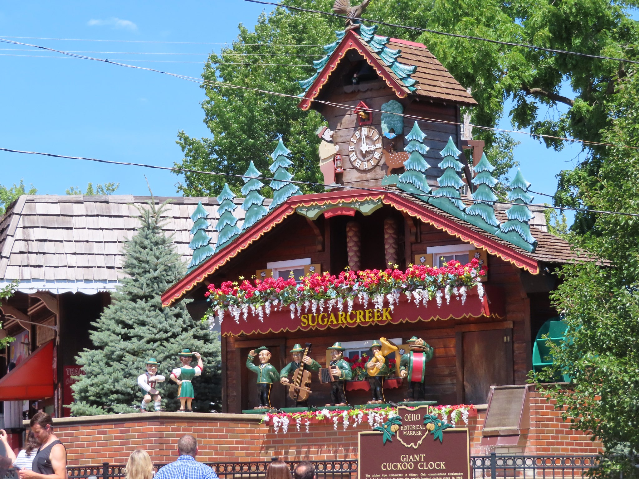 horizontal photo of the world's largest cuckoo clock in sugarcreek ohio with the band and the characters