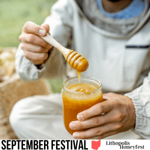close up shot of a bee keeper in uniform pulling a wooden spoon from a honey jar. Made on Canva with pro license Beekeeper Tasting Honey Outdoors RossHelen