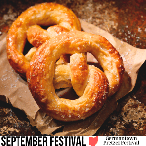 square image with a photo of two pretzels on brown paper with a white strip at the bottom with text September Festival Germantown Pretzel Festival. Image ©LauriPatterson via Canva Pro License