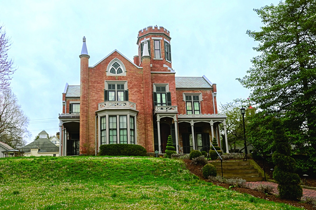 horizontal photo of the castle at marietta with a lawn in the foreground. Image courtesy of the castle at marietta